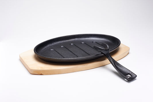 Gusseiserne Servierplatte + Untersetzer, oval, 27 x 17 cm